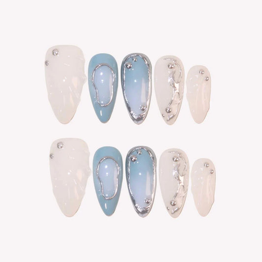 Set of nail art designs with white and light blue colors on a white background
